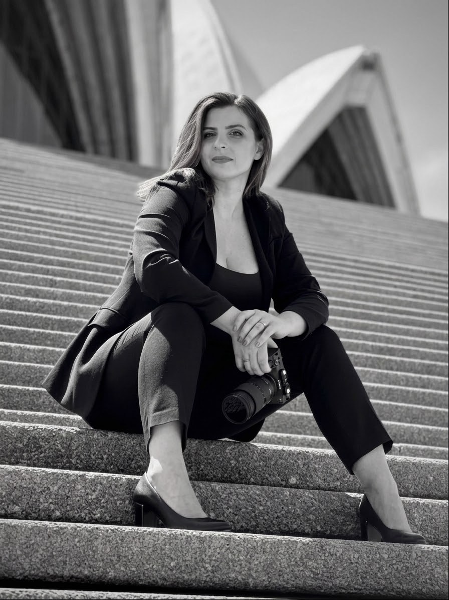Anna on the steps of the Sydney Opera House, camera in hand