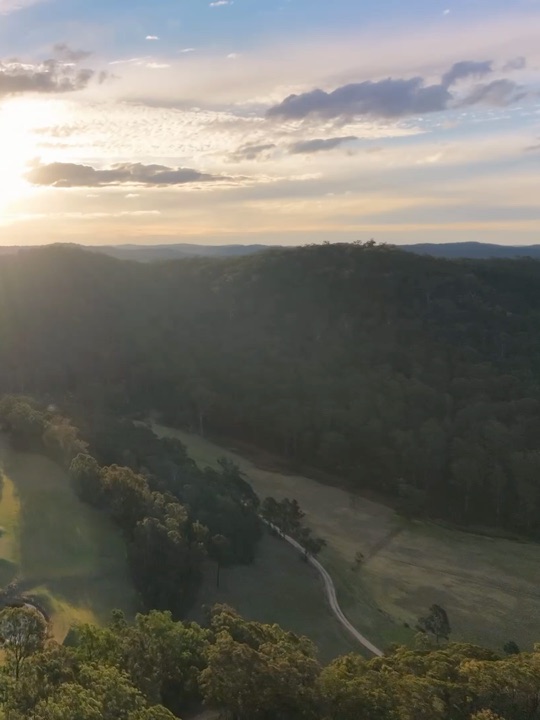 Sunset over bushland from the air